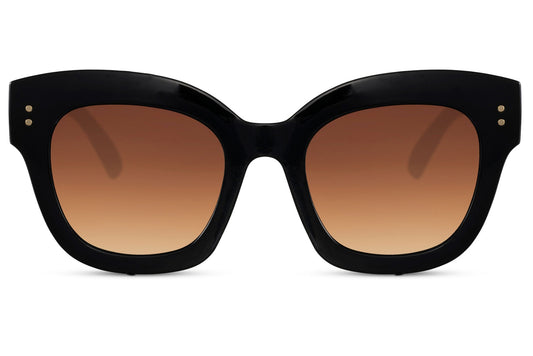 Black oversized cat eye sunglasses with brown gradient lenses and bold frame design