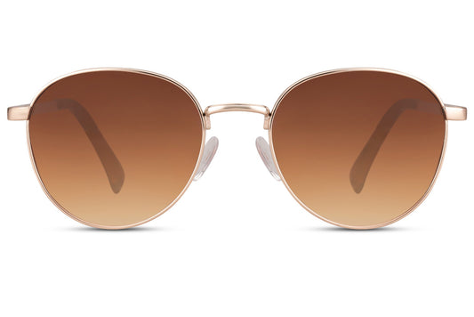 Spain-inspired aviator sunglasses with brown gradient lenses and round metal frame, perfect for stylish everyday wear