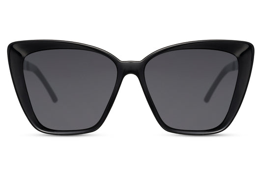 Vintage oversized black cat eye sunglasses with bold geometric frame and dark lenses, designed for statement styling and full UV protection