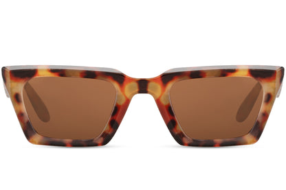 Y2K tortoiseshell cat eye sunglasses with bold patterned frame and tinted lenses, combining retro influence with modern edge