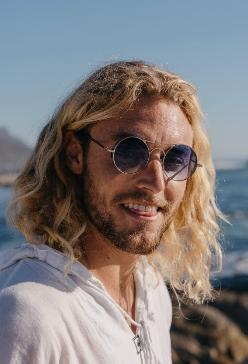 Men wearing tinted metal round sunglasses silver frame blue translucent lens UV400 protection retro vintage summer city outdoor beach holiday festival eyewear free UK Europe shipping Sunglass Station