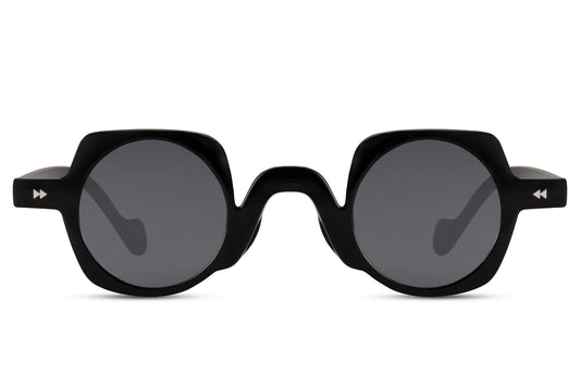 Black round geometric party sunglasses in polycarbonate — bold unisex silhouette with 6.5cm wide lens, the shape that reads equally at a rooftop rave or a creative-district afternoon
