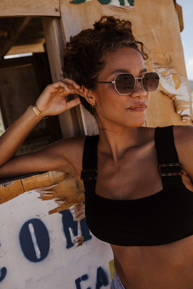 woman wearing brown sunglasses at havana beach
