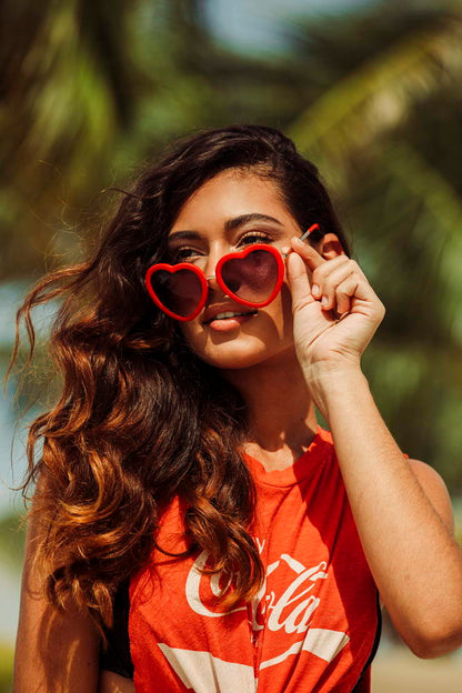 woman wearing love sunglasses at european coastals