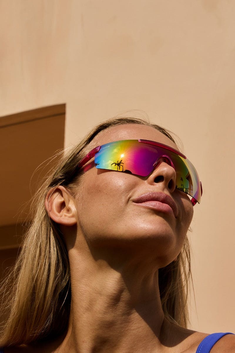 woman wearing visor style sunglasses in ibiza beach club