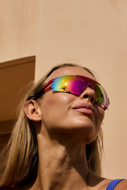woman wearing visor style sunglasses in ibiza beach club